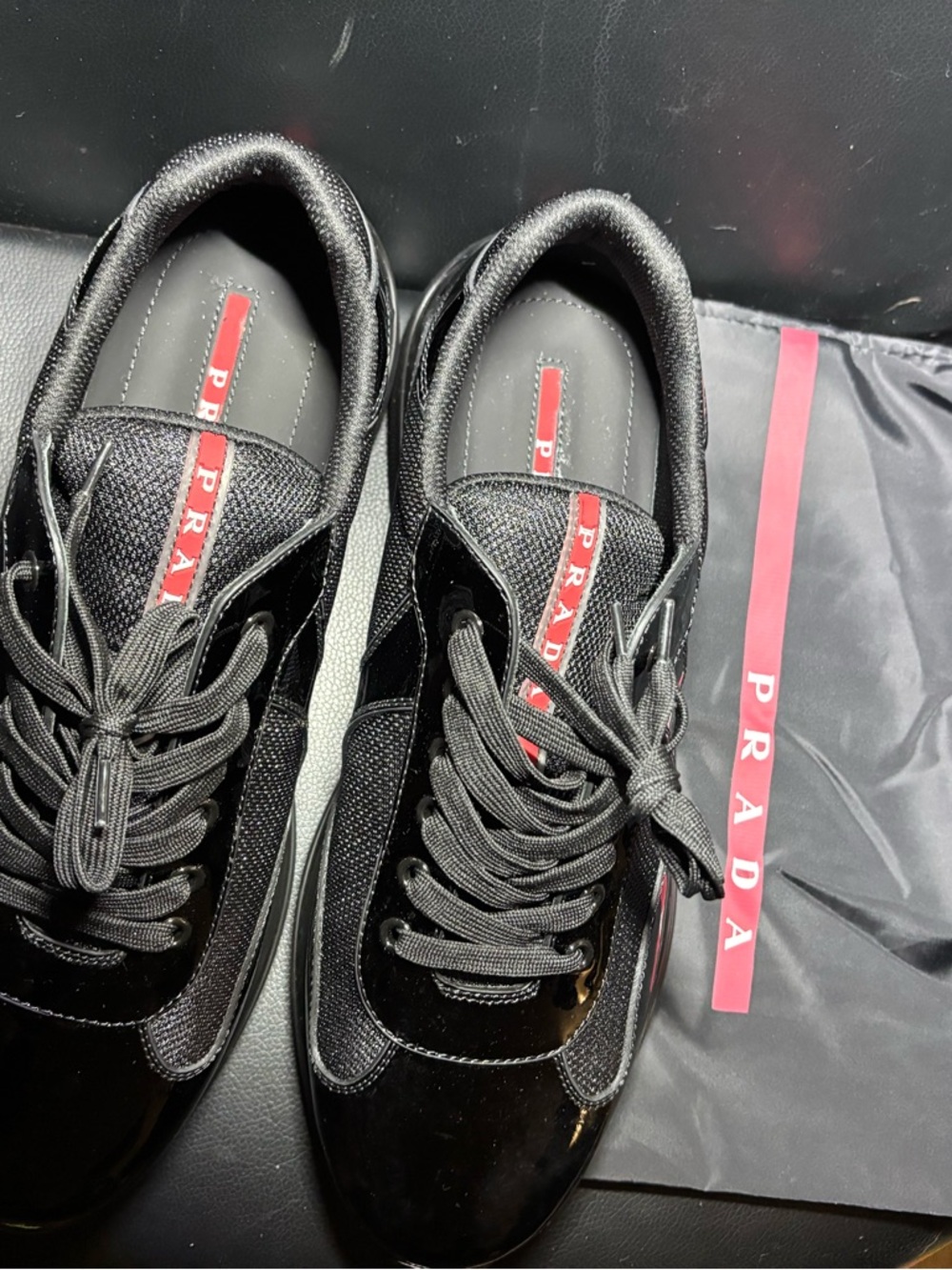 Prada Black Sneakers with Red Logo Stripe